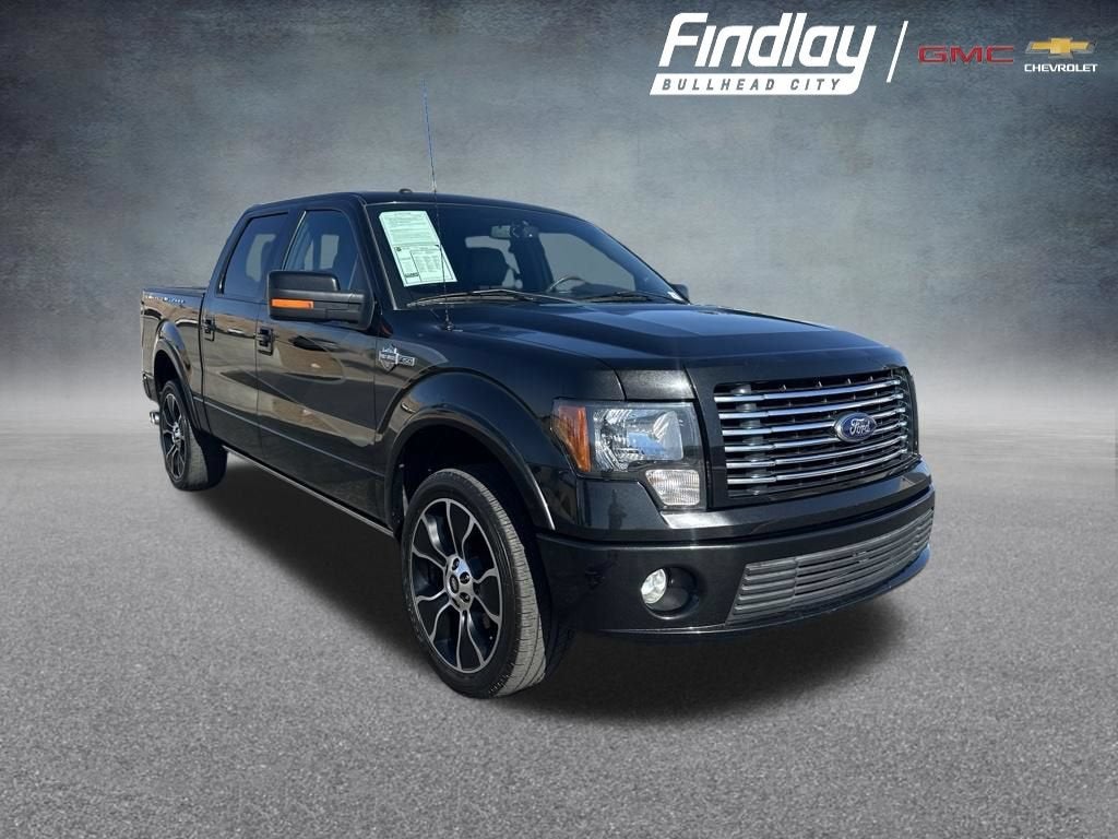 2012 Ford F-150 Lariat in Black — front three-quarter view