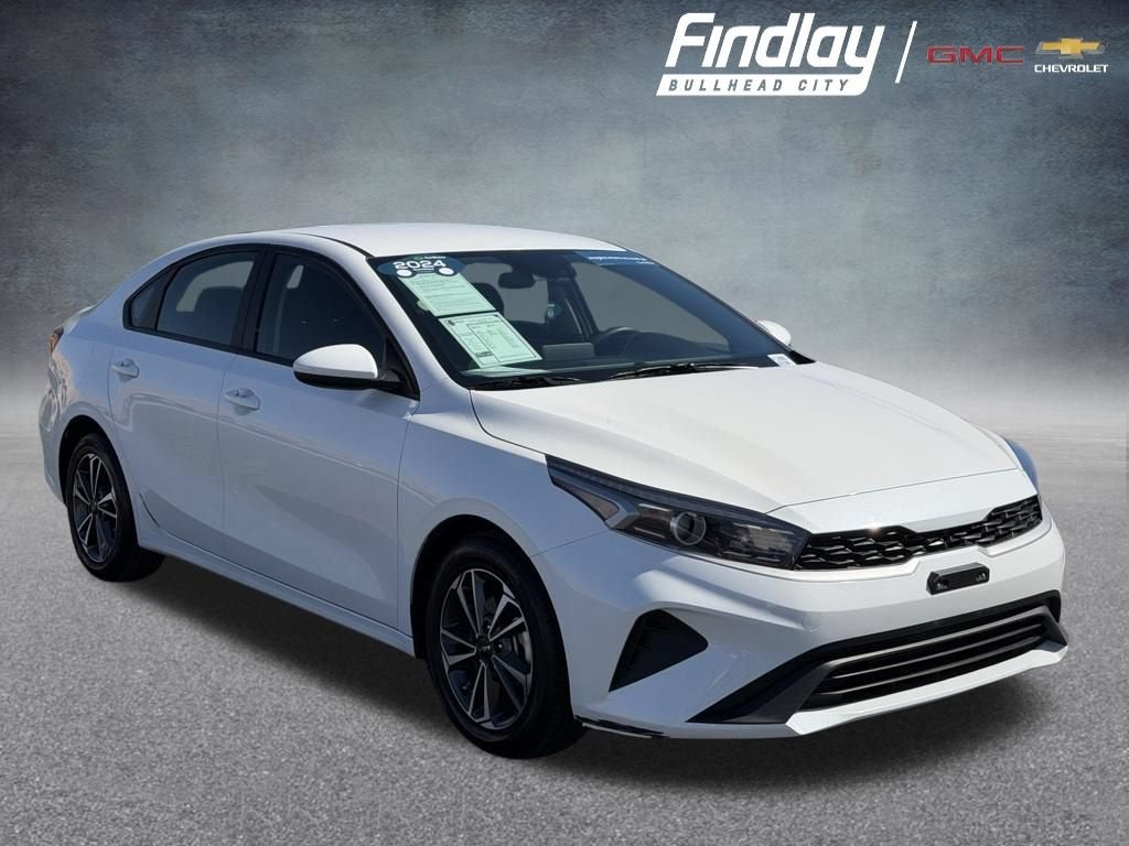 2024 Kia Forte LXS in White — front three-quarter view
